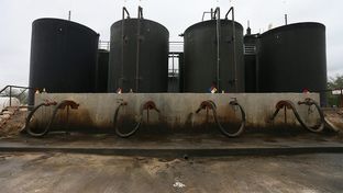 Each day, dozens of trucks hook up to the Gulf Coast-run fracking fluid disposal well site near Gonzales, Texas.