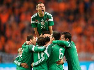 12 November 2014: Paul Aguilar (top) of Mexico celebrates a goal against Netherlands during their international friendly soccer match in the Amsterdam Arena
