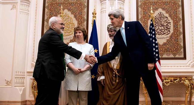 U.S. Secretary of State John Kerry, right, and Iranian Foreign Minister Mohammad Javad Zarif, shake hands. 