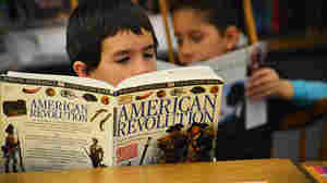 Fourth-grader Isiah Soto digests some history during independent reading time.