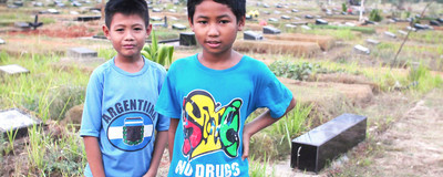 The Kids Who Live and Work in Indonesian Graveyards