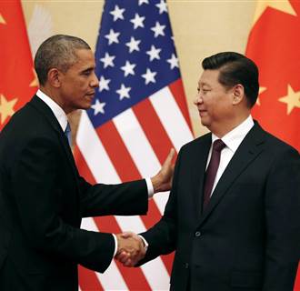 Image: U.S. President Barack Obama and Chinese President Xi Jinping shake hands at the end of their news conference in the Great Hall of the People in Beijing