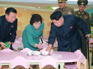 Kim Jong Un Closely Inspects Hello Kitty Set at Orphanage