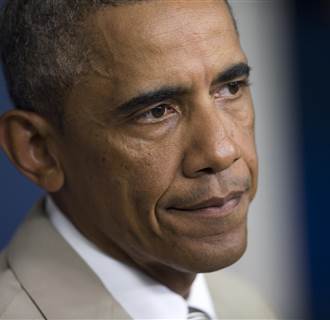 Image: President Barack Obama listens to a question in the James Brady Press Briefing Room