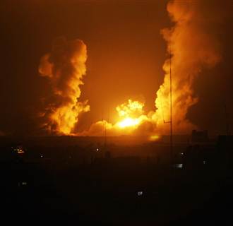 Image: A ball of fire is seen following an Israel airstrike in Rafah, southern Gaza