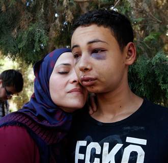Image: Tariq Khdeir is greeted by his mother after being released from jail in Jerusalem