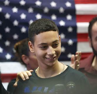 Image: Florida teenager Tariq Khdeir is greeted by family members after his arrival from Israel at Tampa airport