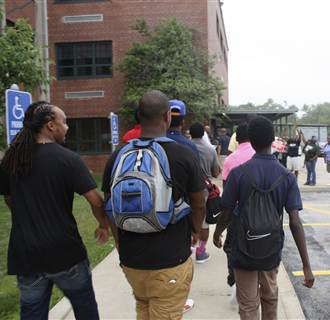 Image: Students return to Normandy High School, the school from which Michael Brown graduated.