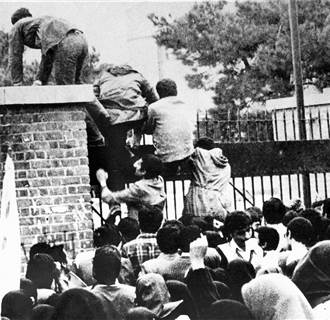 Image: Iranian students climb over the wall of the US embassy in Tehran Nov. 4, 1979