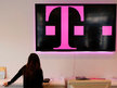 A T-Mobile employee transfers data to a new phone in Torrance, Calif. (Patrick T. Fallon / Bloomberg)