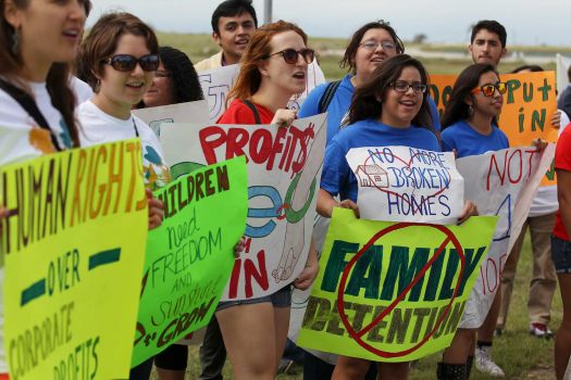About 100 protesters rally in front of the Karnes County Residential Center near Karnes City demanding the closing of the facility and for the release of immigrants detained at the facility on Saturday, Oct. 11, 2014. Photo: Kin Man Hui, San Antonio Express-News / ©2014 San Antonio Express-News