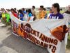 About 100 protesters rally in front of the Karnes County Residential Center near Karnes City demanding the closing of the facility and for the release of immigrants detained at the facility on Saturday, Oct. 11, 2014.