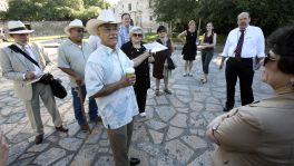 Historian Andrés Tijerina, shown speaking during a May 28 tour with the city’s Alamo Plaza Advisory Committee, said he considers the “critical point” of the Alamo to be the iconic facade of the mission-era church and the area in front of it, including the historic plaza.