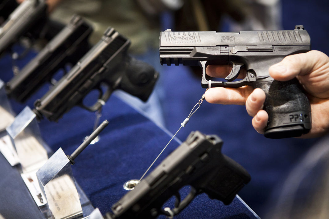 A handgun is displayed during a convention in Reno, Nevada on Jan. 29, 2011. (Photo by Max Whittaker/Reuters)