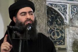 FILE - This file image made from video posted on a militant website Saturday, July 5, 2014, which has been authenticated based on its contents and other AP reporting, purports to show the leader of the Islamic State group, Abu Bakr al-Baghdadi, delivering a sermon at a mosque in Iraq. The leader of the Islamic State group said it will fight to the last man, in a strident audio recording released on social media networks Thursday, Nov. 13, that was his first public statement since a U.S.-led alliance launched airstrikes against his fighters in Iraq and Syria.