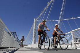Cyclists ride by the Bay Bridge eastern span’s tower on the Alexander Zuckermann bicycle and pedestrian path on its first day of operation, Sept. 3, 2013. Transit officials are exploring the option of creating a bike path that spans the entire bridge, from Oakland to San Francisco.