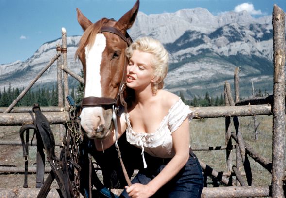 From the traveling exhibit "Marilyn: The Lost Photos Of a Hollywood Star" presented by Limited Runs Nov. 6-8 at Bisong Art Gallery : Marilyn Monroe Horse Photographer: Allan "Whitey" Snyder Date of Image: 1953 Â StartHear! LLC    Back story: This photo was taken on the set of The River of No Return. Its never been seen at all, in fact it wasn't even included in the auction in which Limited Runs acquired these images. It was acquired from Snyder's estate after the auction.