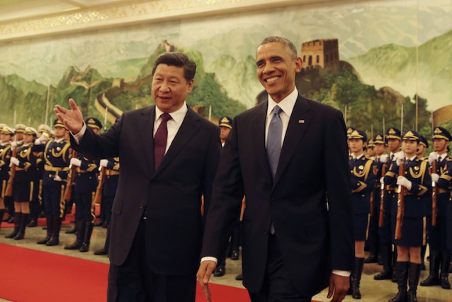 U.S. President Barack Obama, right, with Chinese President Xi Jinping, during a welcome ceremony at the Great Hall of the People in Beijing, China, on Wednesday, November 12, 2014.