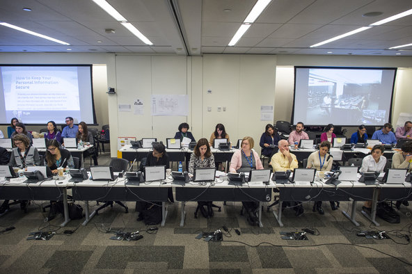 Health department workers in one of their daily meetings at the New York Ebola Command Center.