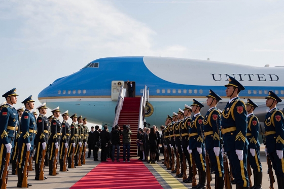 President Barack Obama steps off Air Force One to a red carpet welcome on arrival at Capital International Airport in Beijing