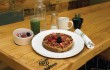 Not fancy, just fabulous: Righteous Foods’ multigrain waffle with fresh fruit juice and acai bowl.