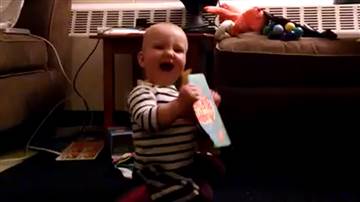 Adorable baby bops to musical birthday card