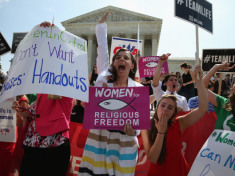 Hobby Lobby supporters react to the U.S. Supreme Court decision, June 30, 2014 in Washington, DC. The high court ruled in a  5-4 decision in favor of Hobby Lobby saying that some private companies can be exempted, on religious grounds, from health care reform's requirement that employer sponsored health insurance policies cover contraception.  (Photo by Mark Wilson/Getty Images)
