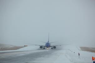 Denver International Airport crews tackle the first snowstorm of the winter, Nov. 12, 2014