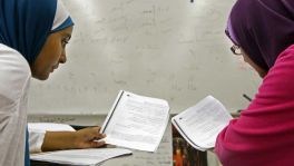 HISD students Sahar Fattani and Amina Wote review a vocabulary lesson in their Level 3 Arabic class at Bellaire High School.