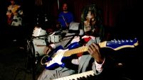 Little Joe Washington, blues musician, performs at the Continental Club, playing two instruments simultaneously, the piano with his elbow, and the guitar with his fingers, in Houston.   ﻿