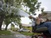 Pino Machado waters his lawn and plants at his home in the 4100 block of Polk June 23, 2009, in Houston.