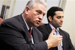  Joel Sansone, left, attorney for Juliann Maier who is one of two Port Authority bus drivers charged with wrecking their buses while racing, discusses the case while attorney Massimo A. Terzigni looks on.