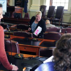 Rep.-elect Charlotte Warren, D-Hallowell, center, chats with fellow new House members Gina Melaragno, D-Auburn, left, and Heidi D. Brooks, D-Lewiston, during orientation day events for new members of the Legislature on Thursday at the State House in Augusta.