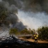 Lone Camp Volunteer Fire Department fire fighter Ted Hale fights a wildfire on September 1, 2011 in Graford, Texas.