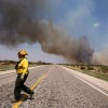 Lone Camp Volunteer Fire Department chief Charlie Sims leads his crew while fighting a wildfire on September 1, 2011 in Graford, Texas.