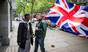 Paul Golding, right, leader of the patriot group 'Britain First', confronts an Islamist outside the High Commission of India in London