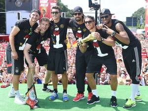 Members of the Germany team celebrate with the World Cup trophy