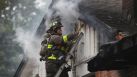 San Antonio firefighters battle a house fire Thursday November 13, 2014 on the 7200 block of Westboro. The cause of the blaze is being investigated and there were no apparent injuries. A car also burned in the blaze.