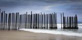 A section of the U.S.-Mexico border wall entering the sea