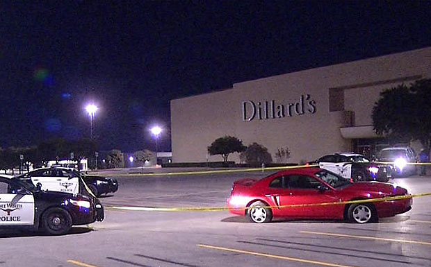 Crime scene tape surrounds the area where a man was stabbed multiple times Thursday night outside Ridmar Mall in Fort Worth. The man died inside the mall after making his way back in to seek help.