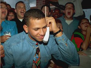 In this June 3, 1993, file photo, Alex Rodriguez listens on the telephone as the Seattle Mariners ask him to join their team as the No. 1 pick in the baseball draft.