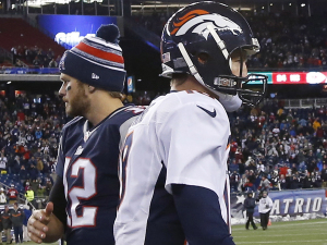 New England Patriots quarterback Tom Brady, left, and Denver Broncos quarterback Peyton Manning after a game Sunday in Foxborough, Massachusetts. The Patriots won 43-21.