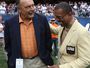 Hall of Fame Chicago Bears Dick Butkus (L) and Gale Sayers share a laugh on the sidelines before a game between the Bears and the Pittsburgh Steelers on September 20, 2009 at Soldier Field in Chicago, Illinois.