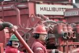 Oil field workers' jobs probably are less at risk than corporate functions under the proposed Halliburton-Baker Hughes merger (Donna McWilliam/AP)