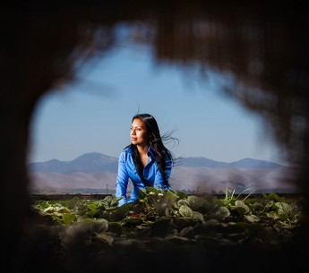 Olga Santos returned for the first time to the strawberry field where she was sprayed with toxic pesticides while eating lunch with her family as a young girl.