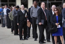 People wait in line to enter the Nassau County Mega Job Fair at Nassau Veterans Memorial Coliseum in Uniondale, New York October 7, 2014. REUTERS/Shannon Stapleton