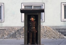 A soldier stands guard at a sentry on the banks of the Yalu River, near the North Korean town of Sinuiju, opposite the Chinese border city of Dandong, November 15, 2014. REUTERS/Jacky Chen