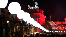 Lit balloons are placed along the former Berlin Wall location near the Brandenburg Gate in Berlin November 8, 2014. (Reuters / Fabrizio Bensch)