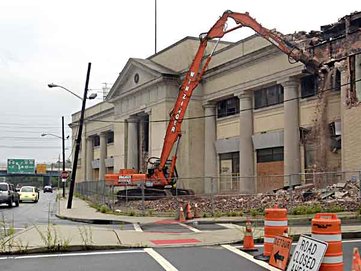 Demolition began in 1013 on the 1927 former Sears building in Camden. ( TOM GRALISH / Staff Photographer ) 