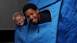 Friend Jack Snell, left, joins Sean in the Sleepover Bed Tent, which features openings for outlets and windows to watch TV.